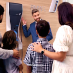 Family looking at BMW iX electric charger